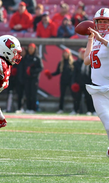 Finley, Wolfpack roll over Louisville 52-10